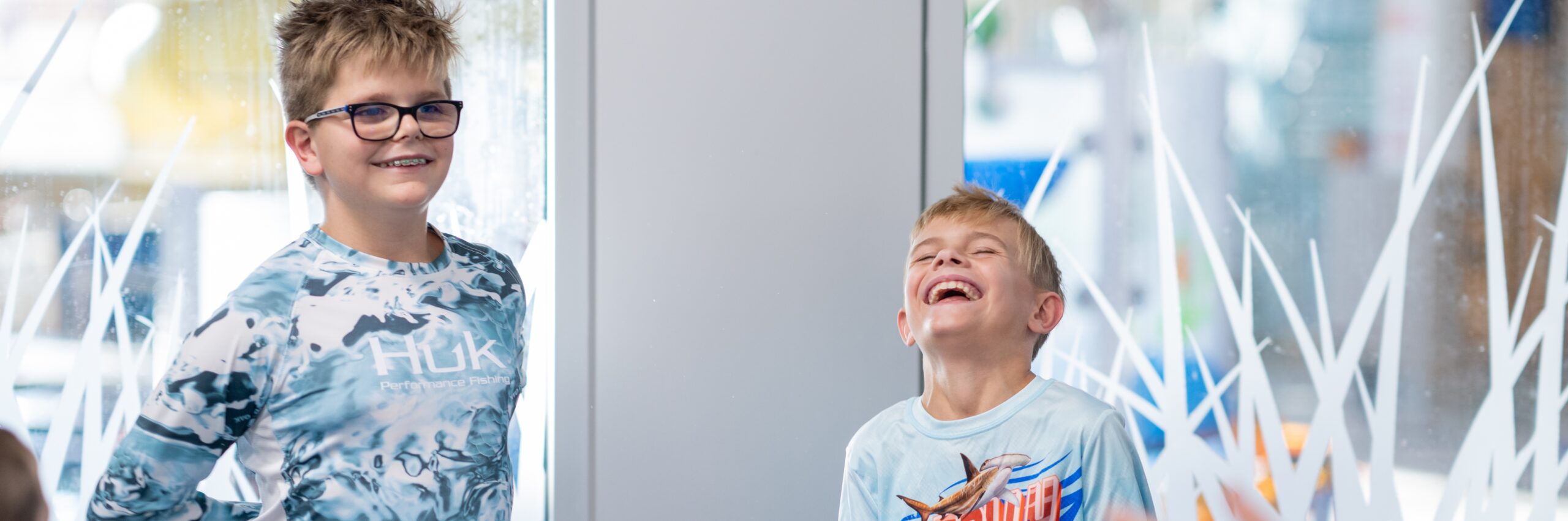 Two kids laughing while in adaptive programming at the Monon Community Center