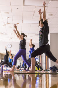 People holding a pose for a yoga class at the Monon Community Center