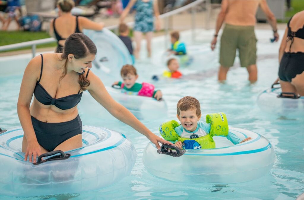 A parent and kiddo at The Waterpark for a splash bash event. 