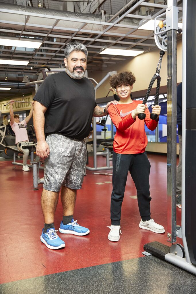 Liendo family working out in the weight area at the Monon Community Center.