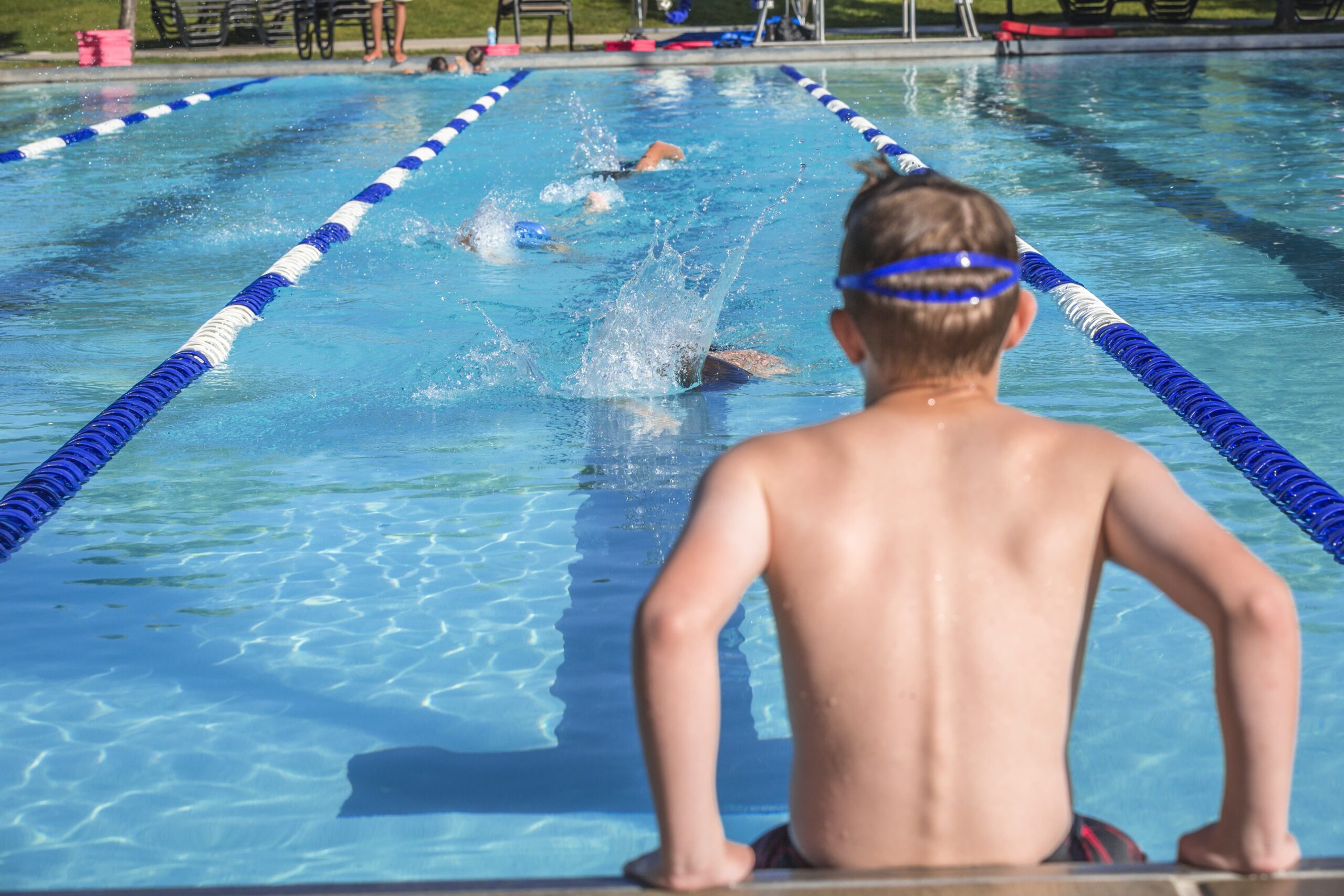 Kids swimming in the pool for the Sea Dragons Swim team.