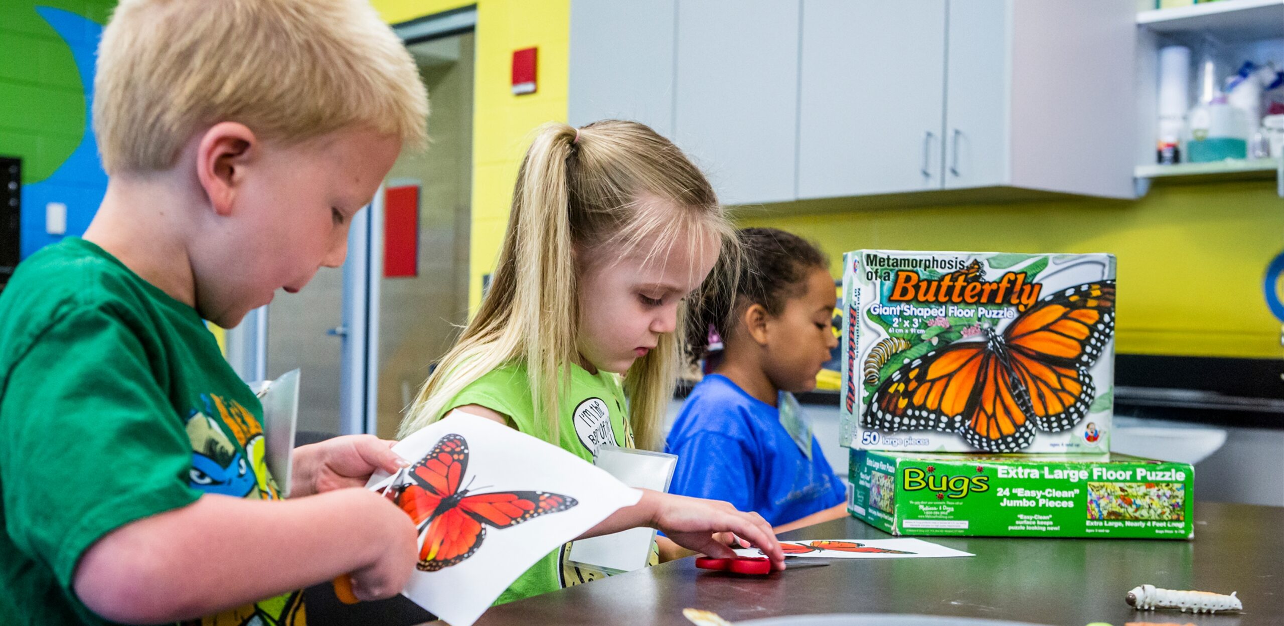 Main slider image of kids in a nature program for the 2025 Winter/Spring program guide.