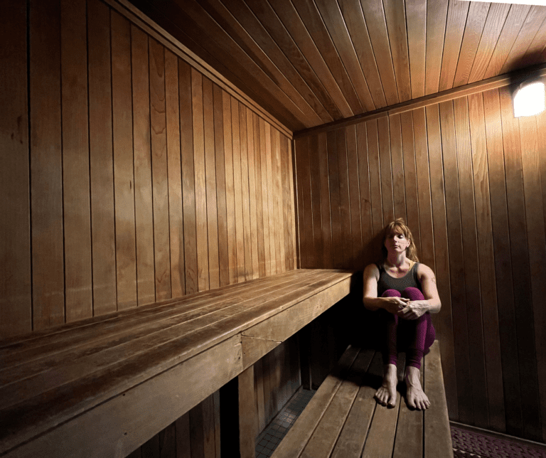 Person sitting in the sauna at the Monon Community Center.